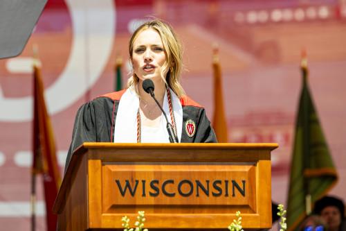 A woman speaks at a podium.